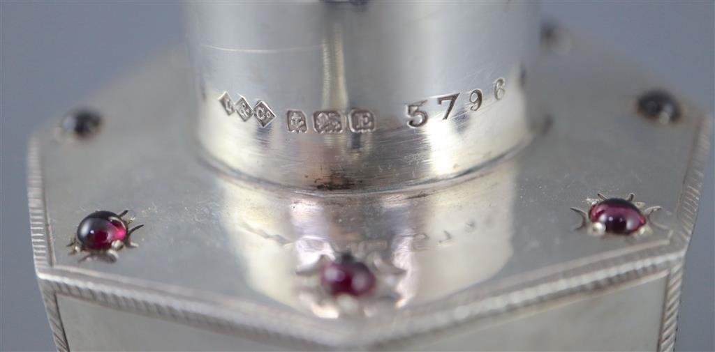 A George V Liberty & Co silver and nine stone cabochon garnet set octagonal tea caddy and cover,